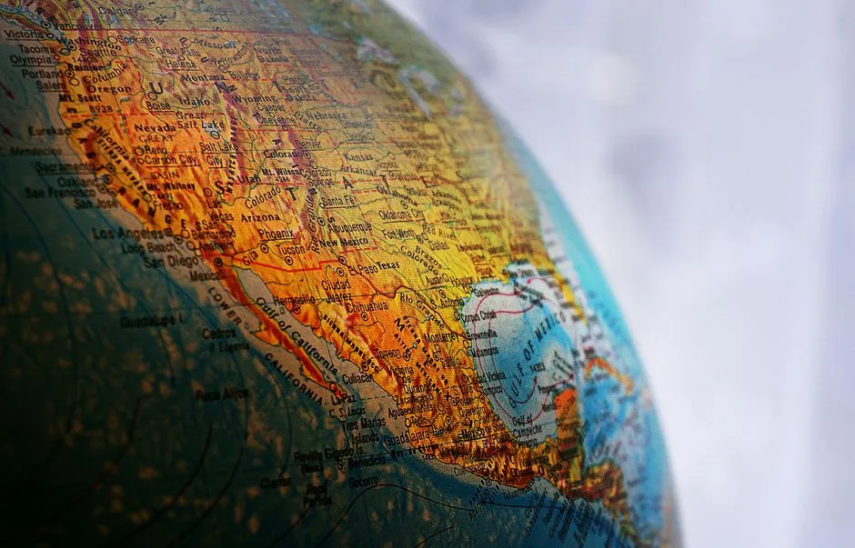 A world globe on a desk, representing the many countries whose fiscal years this site covers.