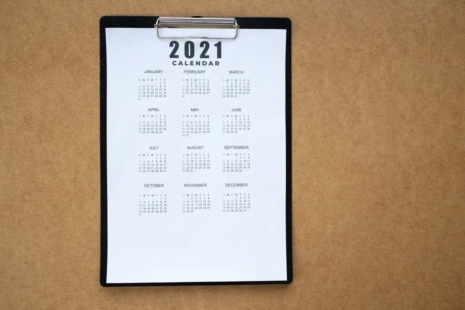 A calendar on a desk, illustrating the concept of a 12-month accounting period that does not have to match the calendar year.